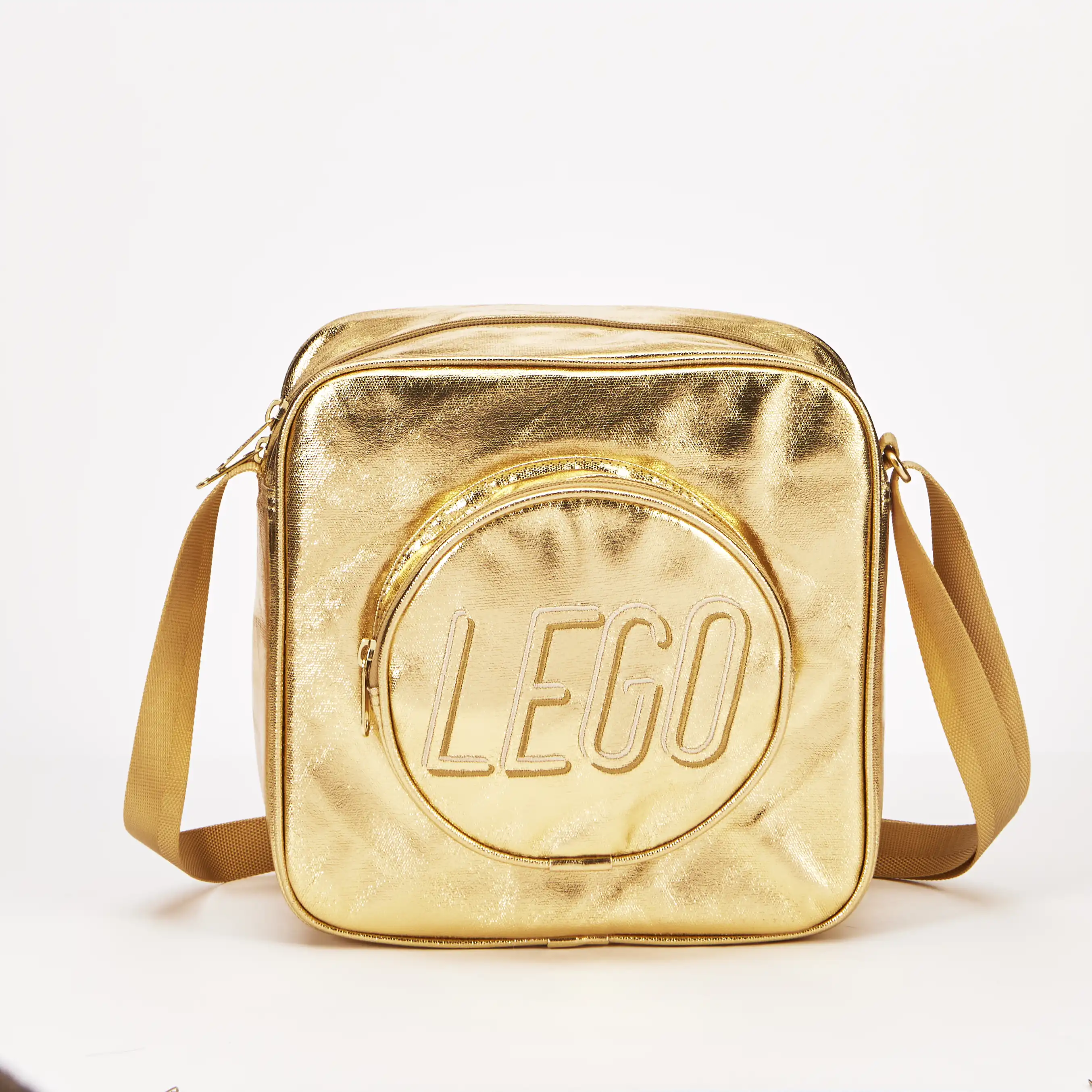 Zdjecie zestawu LEGO 5010892 Inne Mała złota torba listonoszka w kształcie klocka 2